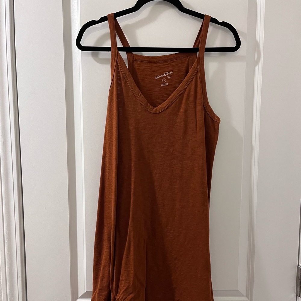 Size small universal thread dress . Burnt orange color .